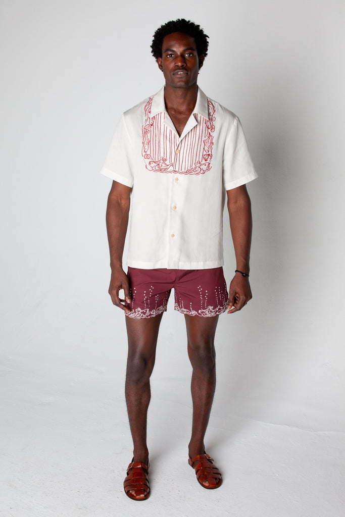 Male model wearing the Fruits De Mer trunks with the matching top