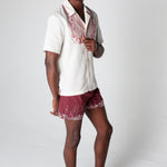Male model wearing the full set looking at the camera over his left shoulder