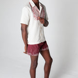 Male model wearing the full set looking at the camera over his left shoulder
