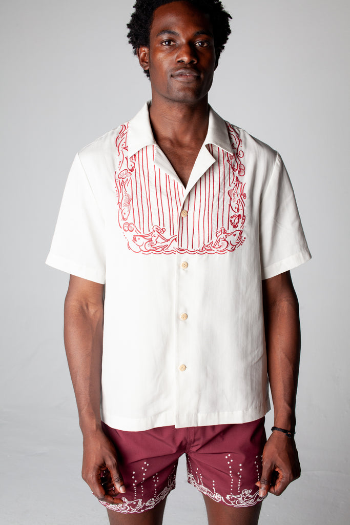 Male model wearing top with matching swim trunks