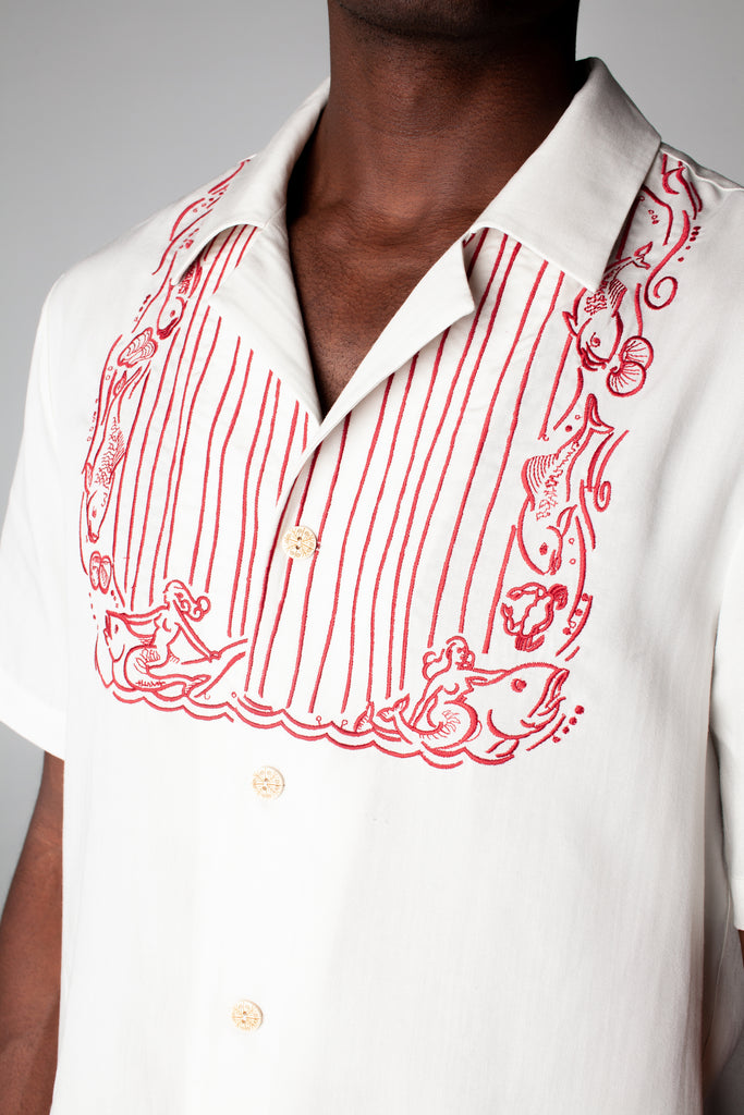 Close up of bib embroidery on male model