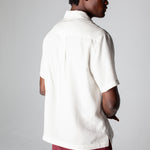 back view of male model wearing the trunks with the matching top