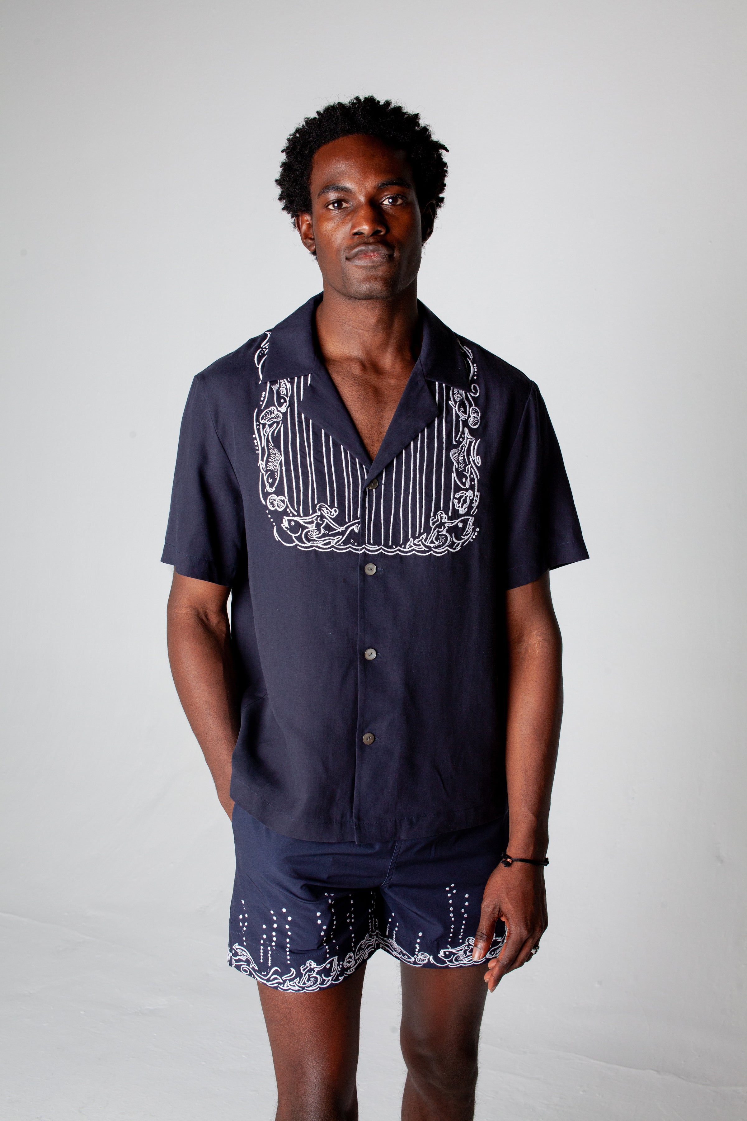 male model wearing full navy fruits de mer set