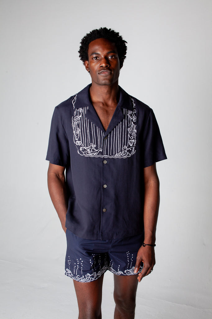 male model wearing full navy fruits de mer set