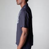 side view of male model in full navy fruits de mer set