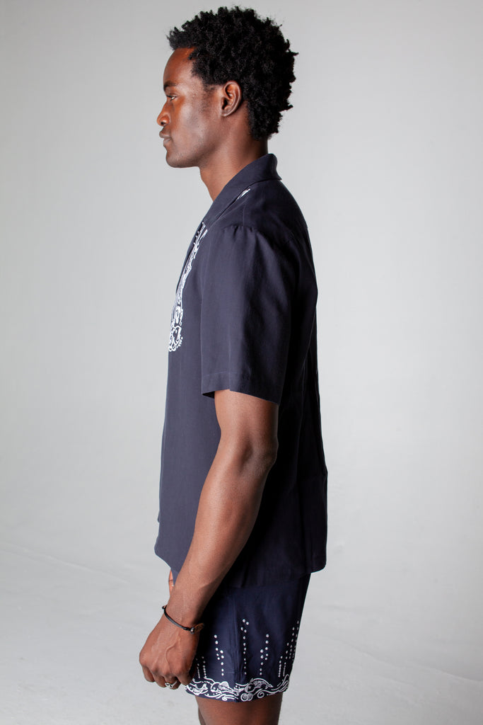 side view of male model in full navy fruits de mer set