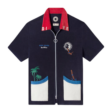 Front lay flat product photo of shirt showing contrasting white zipper and pockets with Embroidery includes cliff divers leaping into the pocket, palm trees, 'Pool Hours' and collar lettering detail
