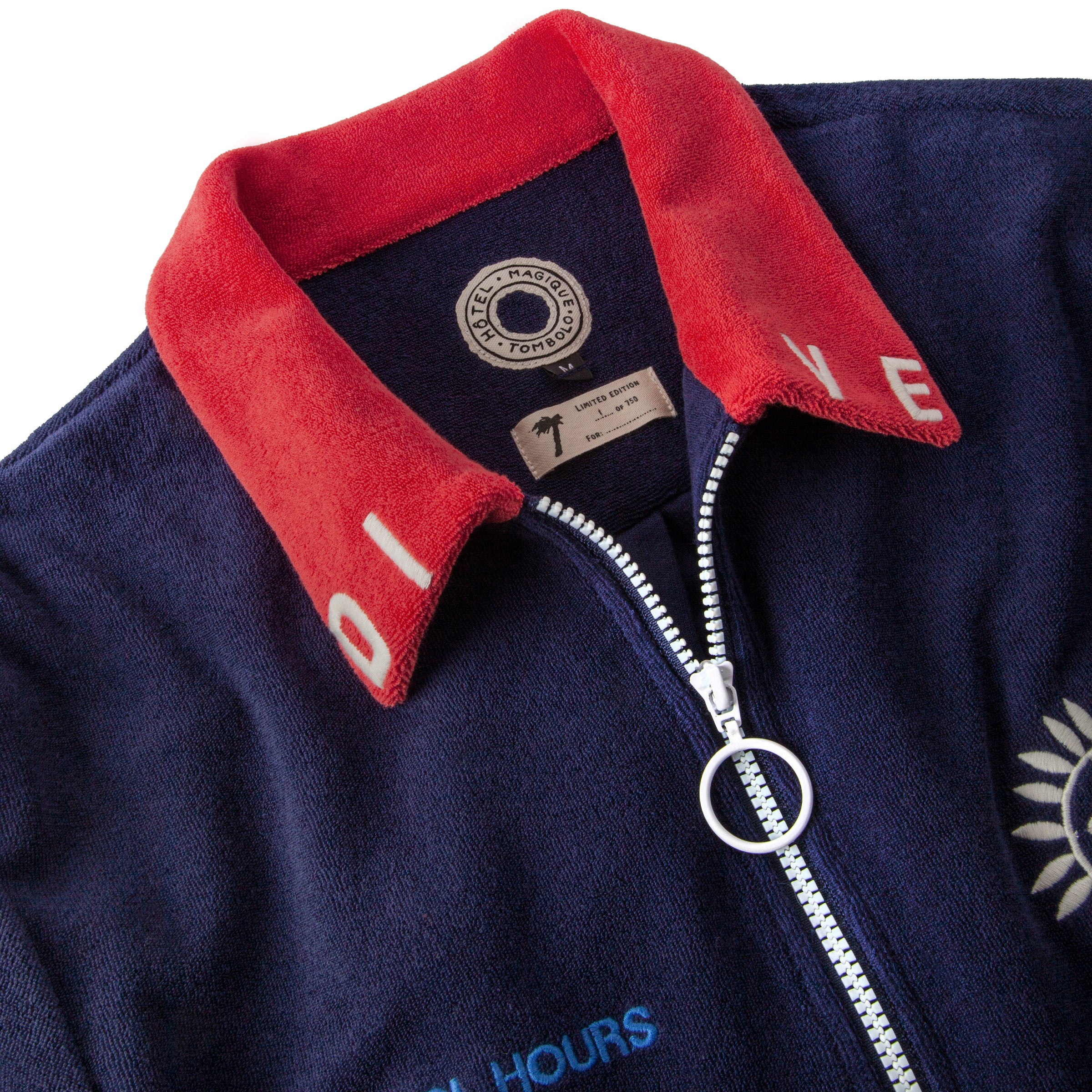 Close up of dive embroidery on collar, letters D and I on left side and V and E on the right