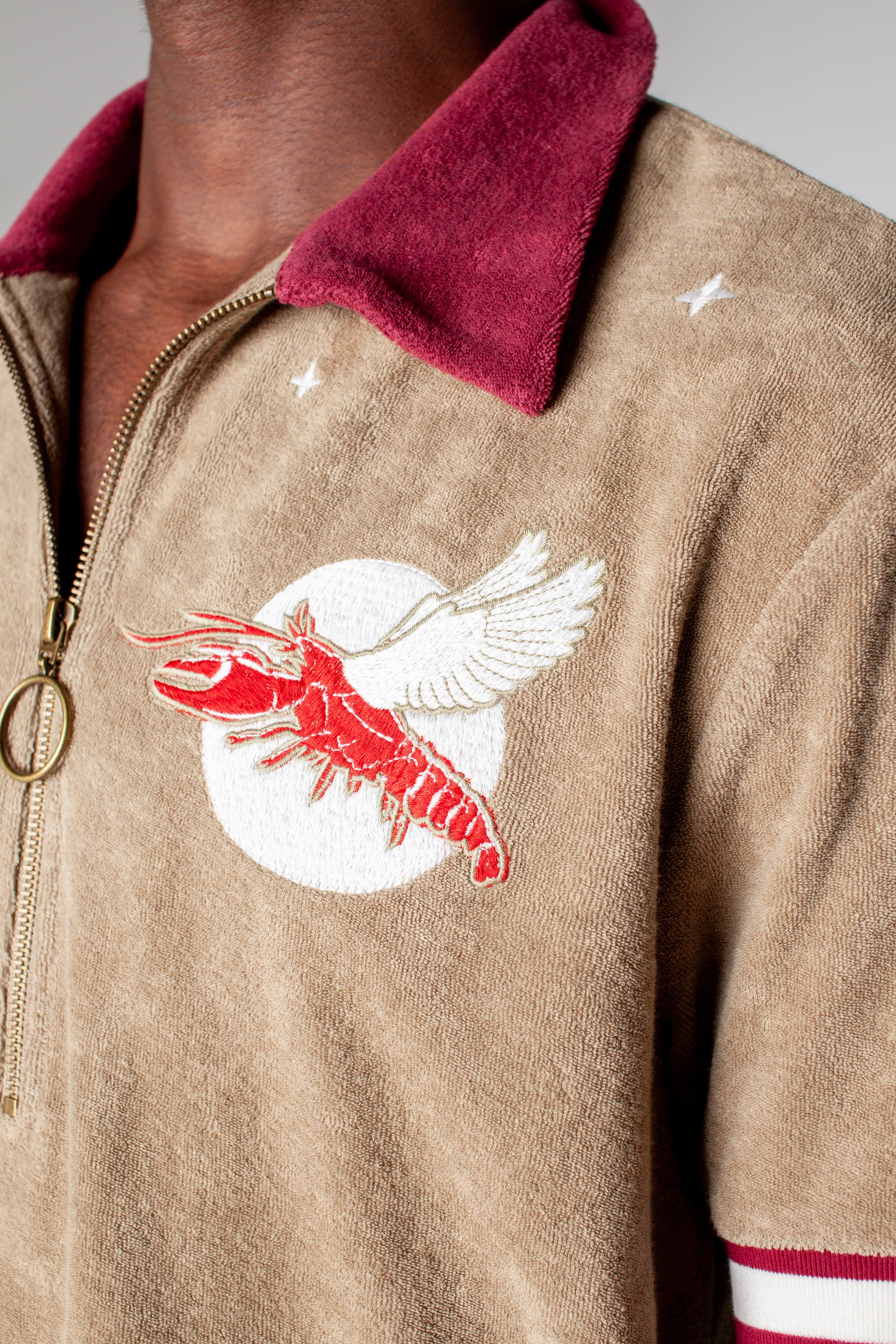 fun playful lobster motif embroidered into organic cotton terry cloth eclipsing the moon amidst a starry night perfect for day or night