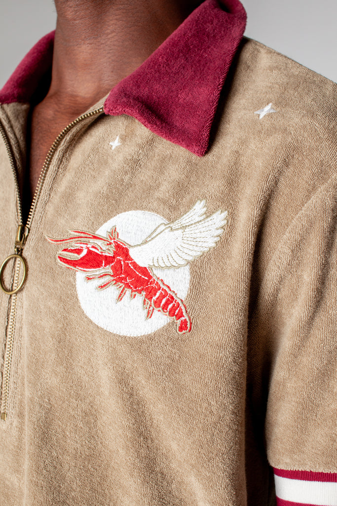 fun playful lobster motif embroidered into organic cotton terry cloth eclipsing the moon amidst a starry night perfect for day or night