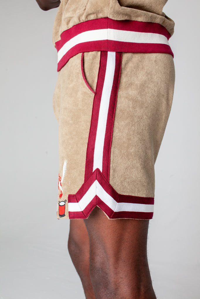 side view of male model wearing shorts showing jersey stripe