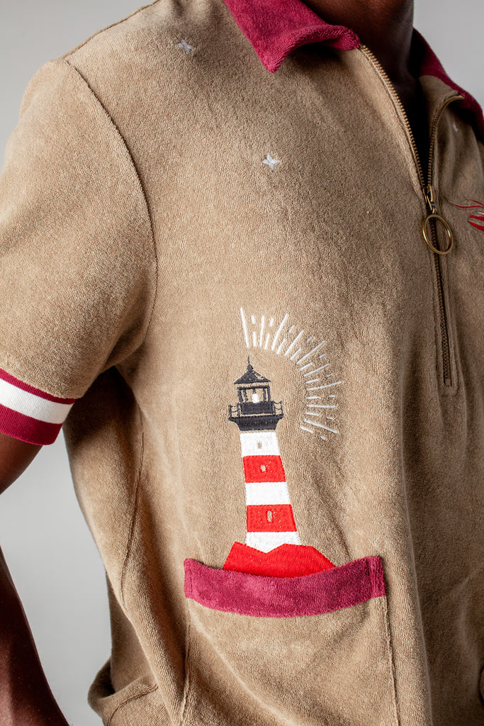 organic cotton terry cloth cabana shirt brings an emrbroidered lighthouse motif to this stylish and playful caban shirt that is a part of a matching set perfect for seaside escape