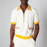 Embroidered fork with pasta. Edge embroidered pockets with classic ingredients. This terry cloth souvenir shirt is the ideal resortwear for your escape.