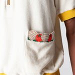 featuring an embroidered fork with pasta and edge embroidered pockets with classic ingredients, this souvenir shirt is the ideal resortwear for your escape.