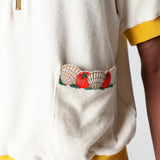 featuring an embroidered fork with pasta and edge embroidered pockets with classic ingredients, this souvenir shirt is the ideal resortwear for your escape.