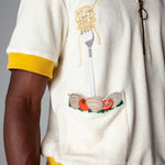 Dine al fresco in a Terry cloth shirt with all the ingredients you need for spaghetti alle vongole, part of a matching set with 'Vongole' Cabana Shorts. featuring an embroidered fork with pasta