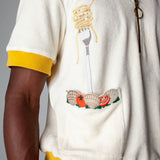 Dine al fresco in a Terry cloth shirt with all the ingredients you need for spaghetti alle vongole, part of a matching set with 'Vongole' Cabana Shorts. featuring an embroidered fork with pasta