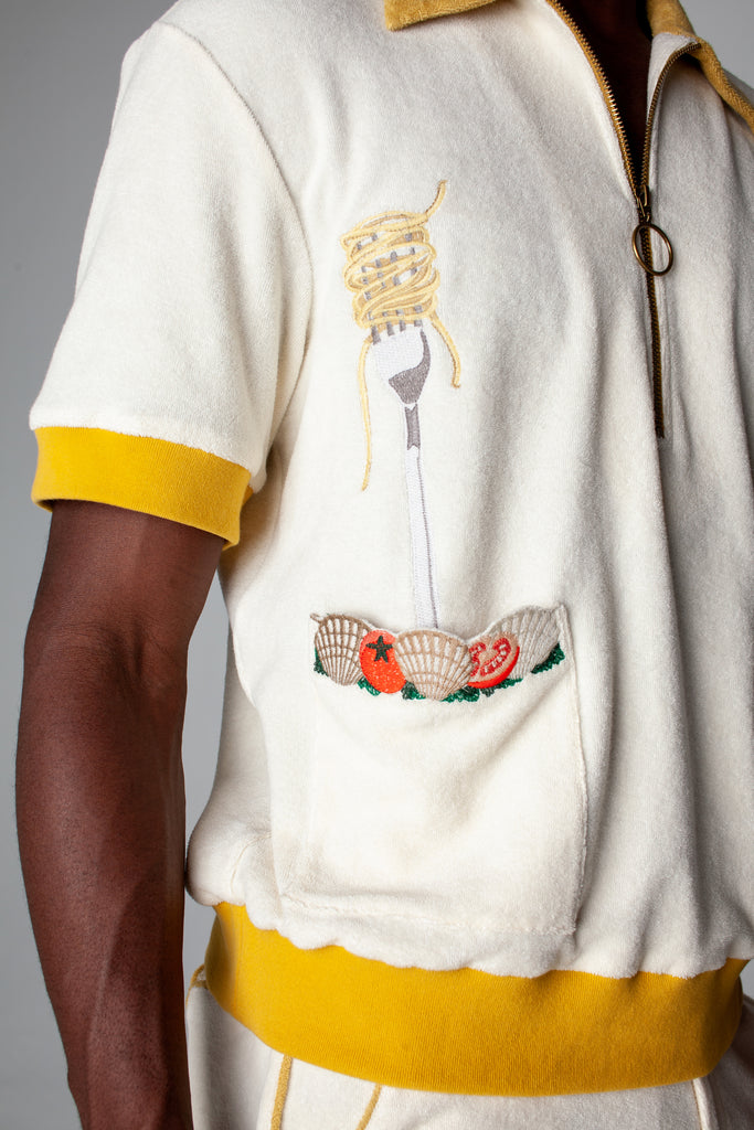 Dine al fresco in a Terry cloth shirt with all the ingredients you need for spaghetti alle vongole, part of a matching set with 'Vongole' Cabana Shorts. featuring an embroidered fork with pasta