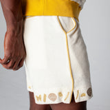 Side close up of man wearing vongole shorts with waistband of matching shirt showing