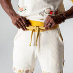 Mid body shot of man tying waistband on shorts