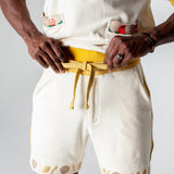 Mid body shot of man tying waistband on shorts