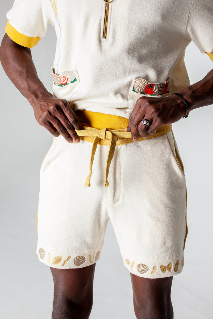 Mid body shot of man tying waistband on shorts