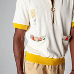 featuring an embroidered fork with pasta and edge embroidered pockets with classic ingredients, this organic cotton terry cloth cabana shirt is sure to have you dining in style