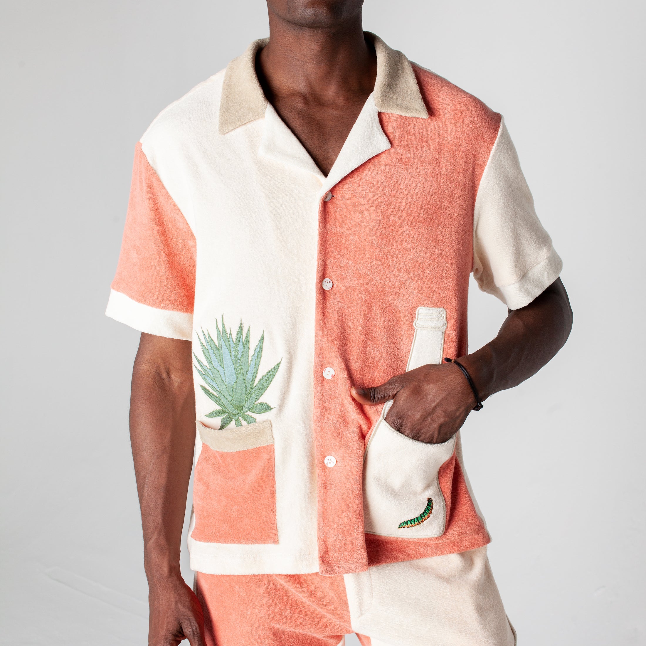 Male model wearing Gusanito shirt along with the matching shorts