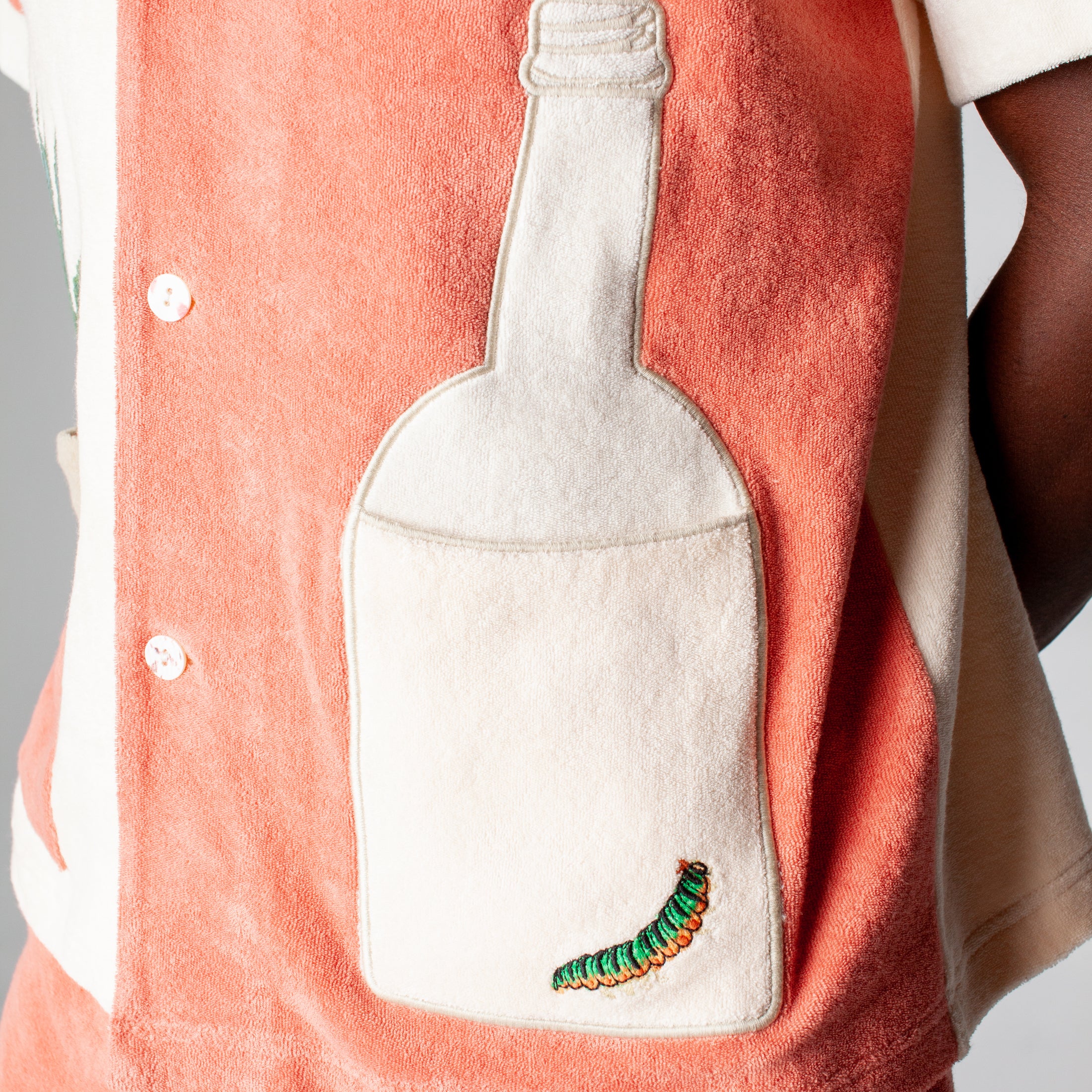 Close up of the right tequila bottle patch that doubles as a pocket