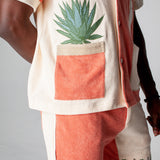 Left side of the Tombolo Gusanito tequila shirt featuring s a fun agave plant embroidered, in which the pot doubles as a pocket