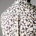 Close up of back of collar of shirt and box pleat on male model