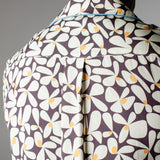 Close up of back of collar of shirt and box pleat on male model