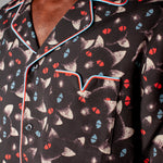 Close up of shirt collar and pocket with red and blue piping