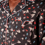 Close up of shirt collar and pocket with red and blue piping