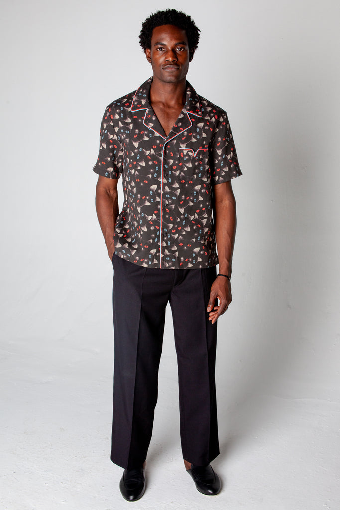 male model posing in shirt and black dress pants