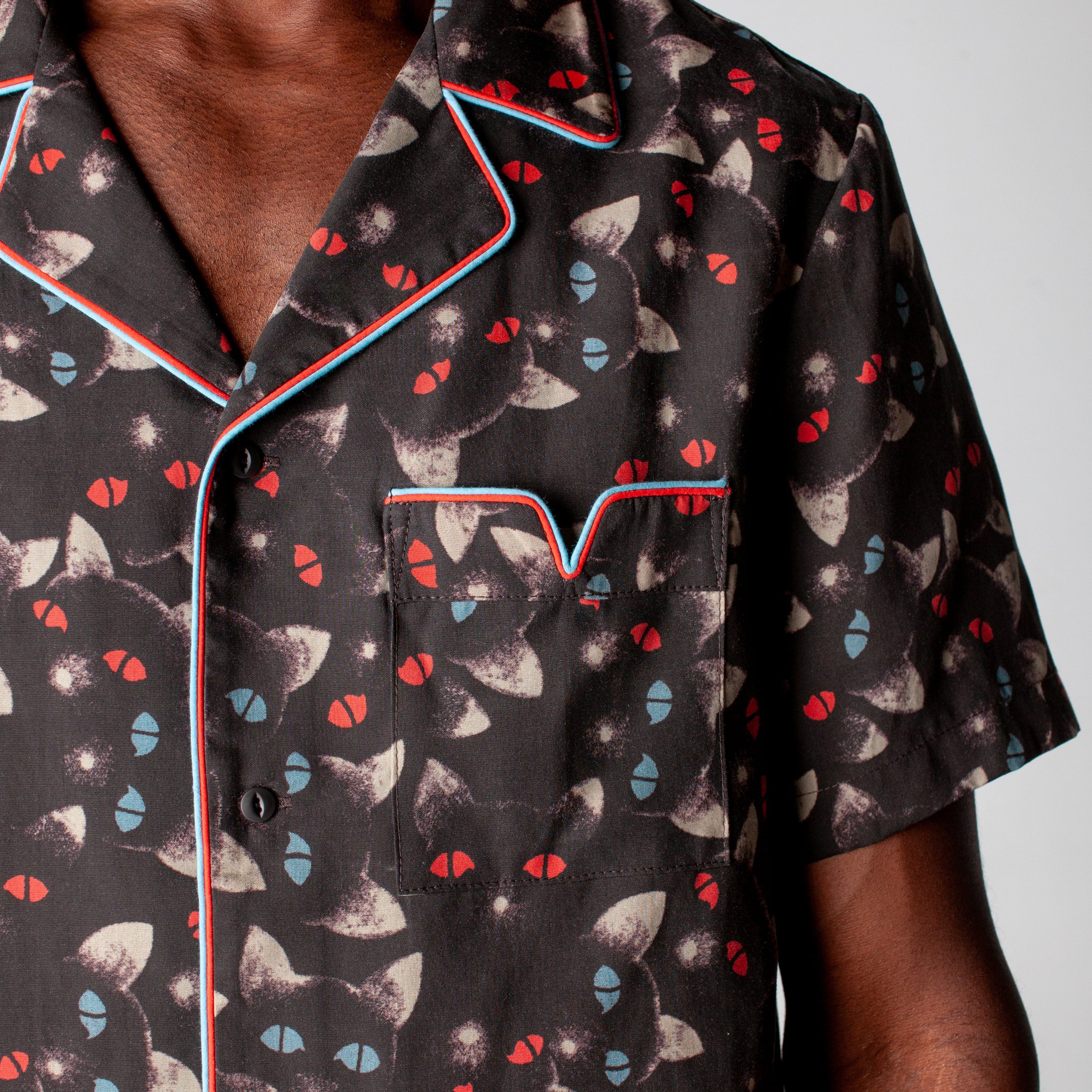 close up view of v pocket on front of shirt