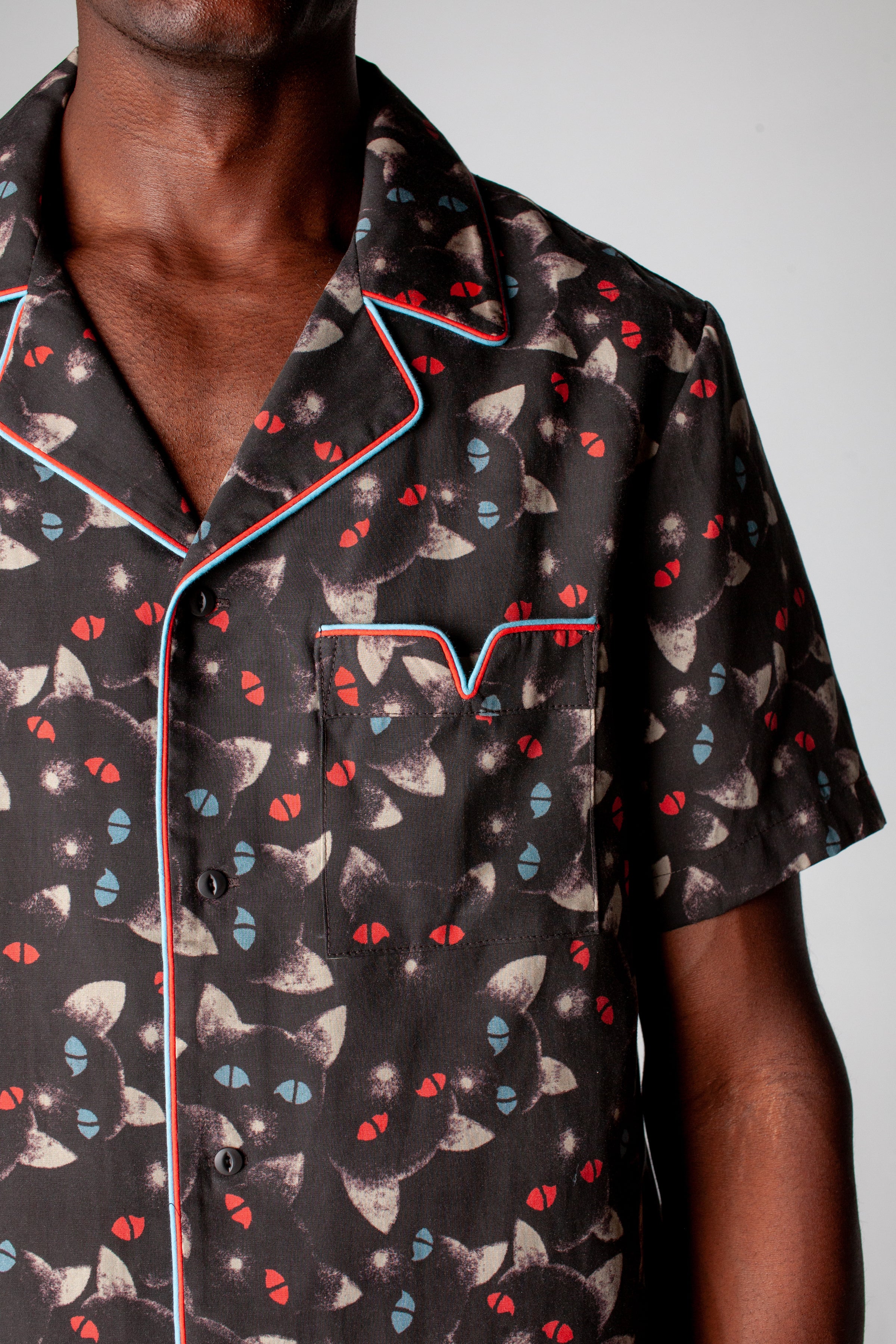 close up view of v pocket on front of shirt