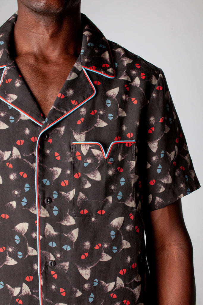 close up view of v pocket on front of shirt